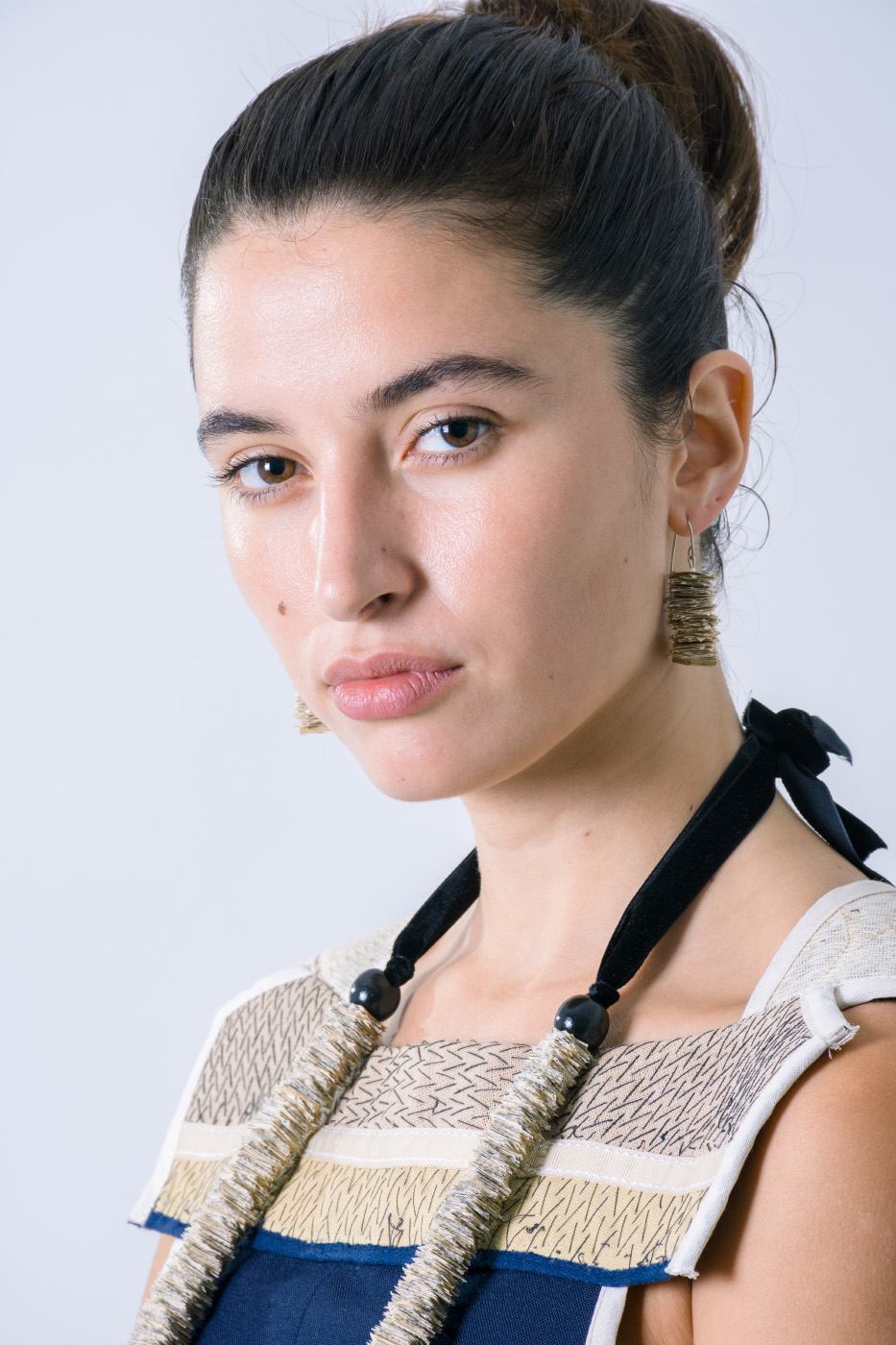 Close up of a eautiful woman portrait with paper necklace